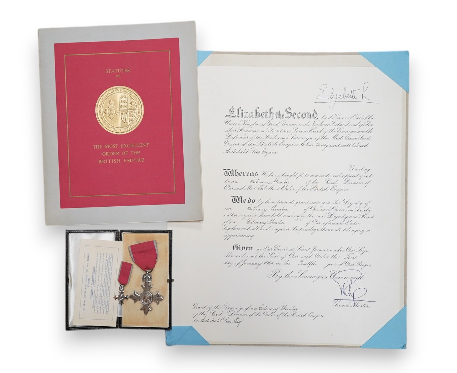 An MBE for Archibald Lees with miniature and an Imperial Service Medal for Thomas Lees, a silver coaster and silver match case with coronet over ‘E’ and ‘Holyrood 1925’ to reverse